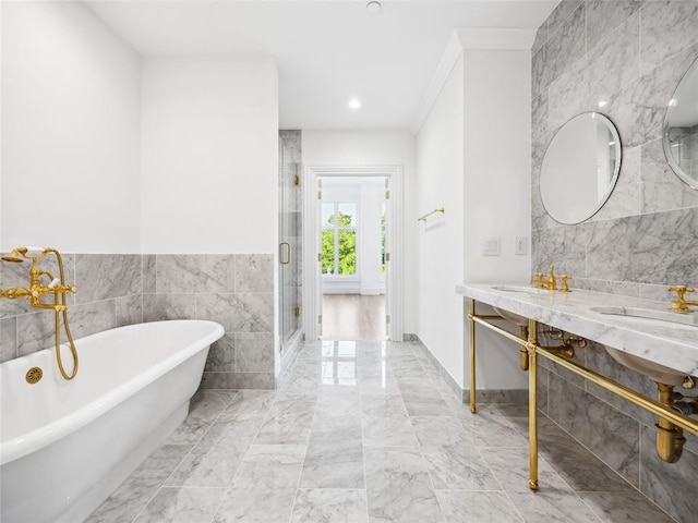 6100 NW Grand Blvd Unit 6103, Oklahoma City, OK 73118 - full bath with marble tiled flooring, a soaking tub, a shower stall, tile walls, and double vanity