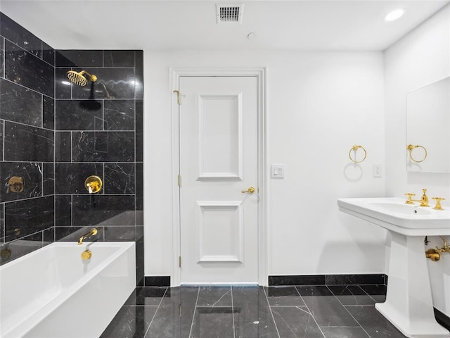 6100 NW Grand Blvd Unit 6103, Oklahoma City, OK 73118 - bathroom with baseboards, a sink, and  shower combination