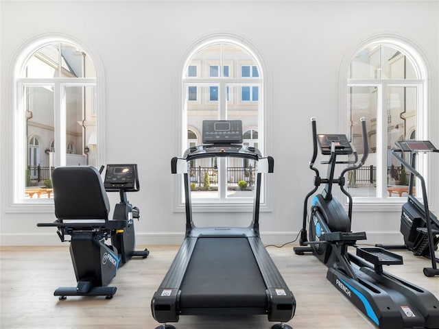 6100 NW Grand Blvd Unit 6103, Oklahoma City, OK 73118 - exercise area with light wood-style floors and baseboards