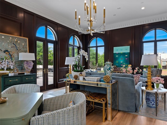 6119 NW Grand Blvd, Oklahoma City, OK 73118 - living room with a decorative wall, a chandelier, french doors, crown molding, and light wood-style floors