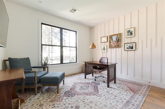 home office featuring light wood-type flooring and baseboards