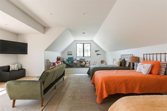 bedroom featuring vaulted ceiling and wood finished floors