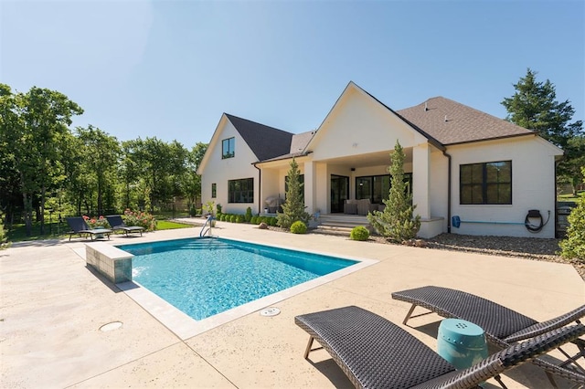 swimming pool featuring a patio area