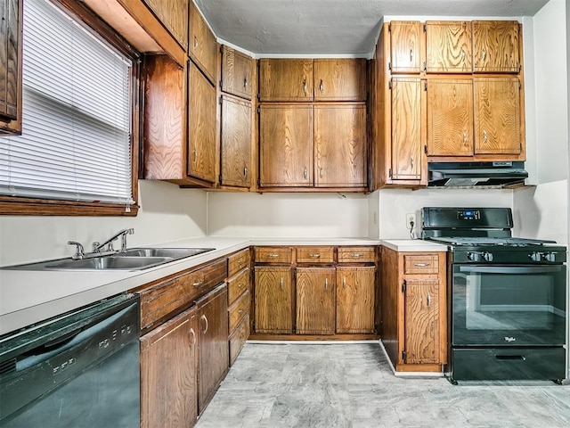 kitchen with black appliances, under cabinet range hood, a sink, and light countertops