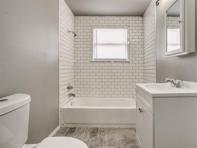 bathroom with toilet, vanity, and bathtub / shower combination