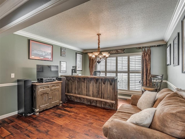 1409 Echohollow Trl, Edmond, OK 73025 - living area with crown molding, dark wood finished floors, a chandelier, baseboards, and a textured ceiling