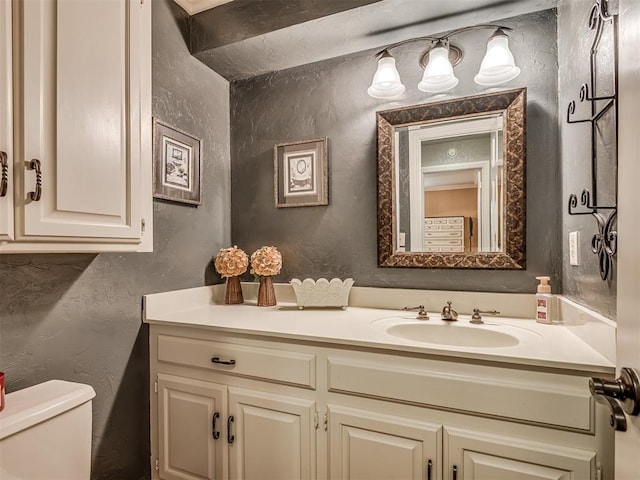 1409 Echohollow Trl, Edmond, OK 73025 - half bathroom with a textured wall, vanity, and toilet