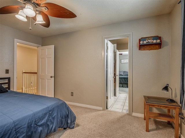 1409 Echohollow Trl, Edmond, OK 73025 - bedroom with light colored carpet and ceiling fan
