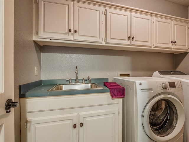 1409 Echohollow Trl, Edmond, OK 73025 - laundry area with a textured wall, washing machine and dryer, and cabinet space