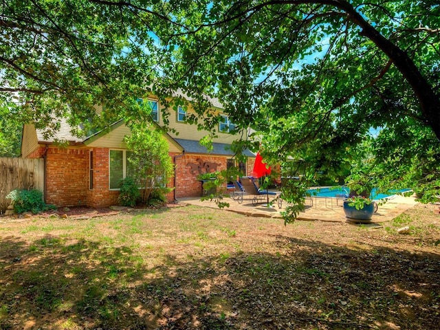 1409 Echohollow Trl, Edmond, OK 73025 - view of yard with a patio and an outdoor pool