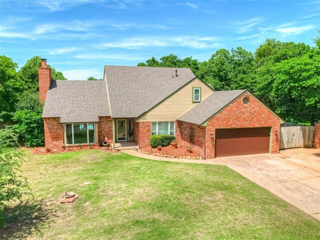 1409 Echohollow Trl, Edmond, OK 73025 - view of front of house featuring a chimney, a garage, brick siding, a shingled roof, and driveway