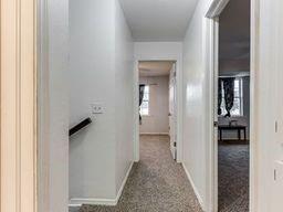 2624 N Ann Arbor St Unit 106, Oklahoma City, OK 73127 - hall with baseboards and carpet flooring
