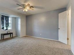 2624 N Ann Arbor St Unit 106, Oklahoma City, OK 73127 - spare room with baseboards and a ceiling fan