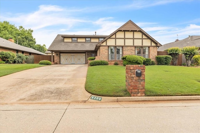6309 Kingsbridge Dr, Oklahoma City, OK 73162 - tudor home featuring driveway, brick siding, and an attached garage
