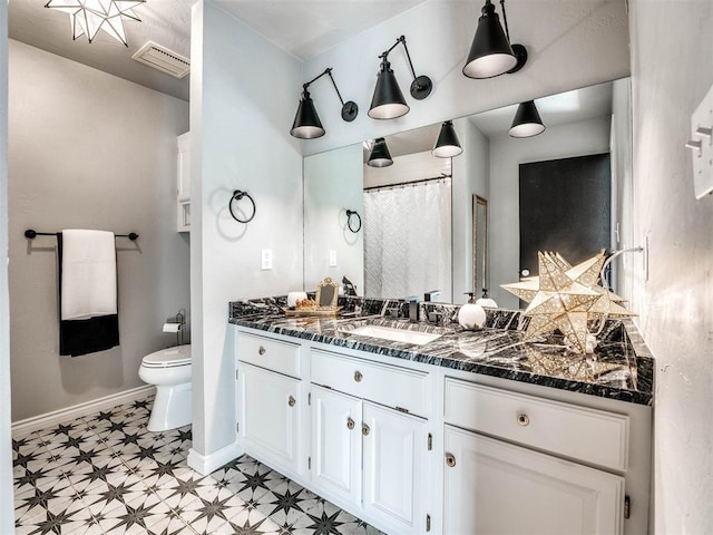 full bath featuring tile patterned floors, toilet, baseboards, and vanity