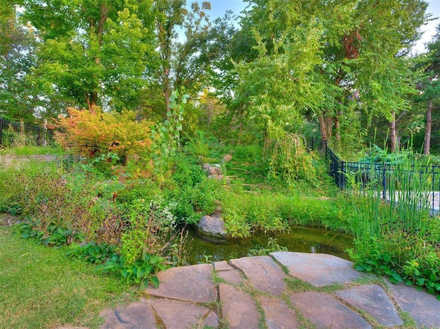 view of yard featuring fence and a patio area