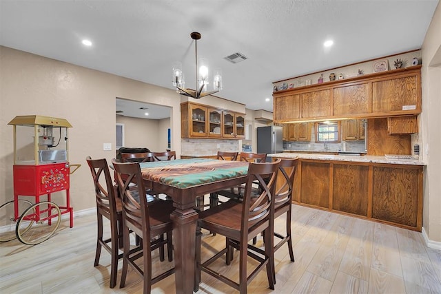 11747 N 2240th Rd, Cordell, OK 73632 - dining room featuring light wood-type flooring, a chandelier, baseboards, and recessed lighting
