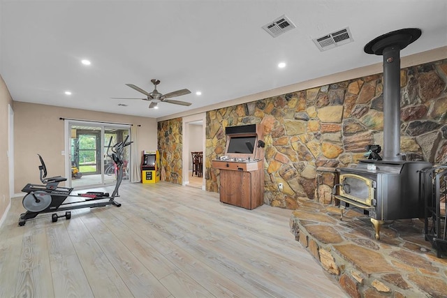 11747 N 2240th Rd, Cordell, OK 73632 - workout room featuring a wood stove, wood finished floors, ceiling fan, and recessed lighting