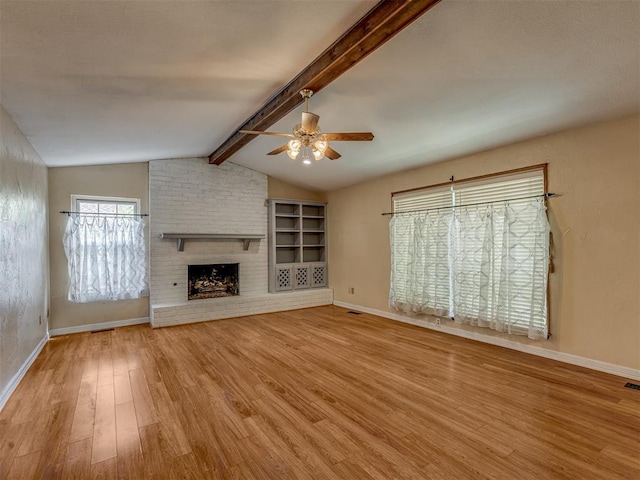 8709 NW 86th St, Oklahoma City, OK 73132 - unfurnished living room featuring a ceiling fan, wood finished floors, baseboards, and a brick fireplace