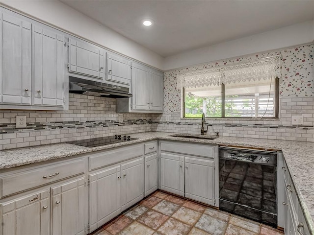 8709 NW 86th St, Oklahoma City, OK 73132 - kitchen featuring black appliances, a sink, under cabinet range hood, decorative backsplash, and light stone finish floors