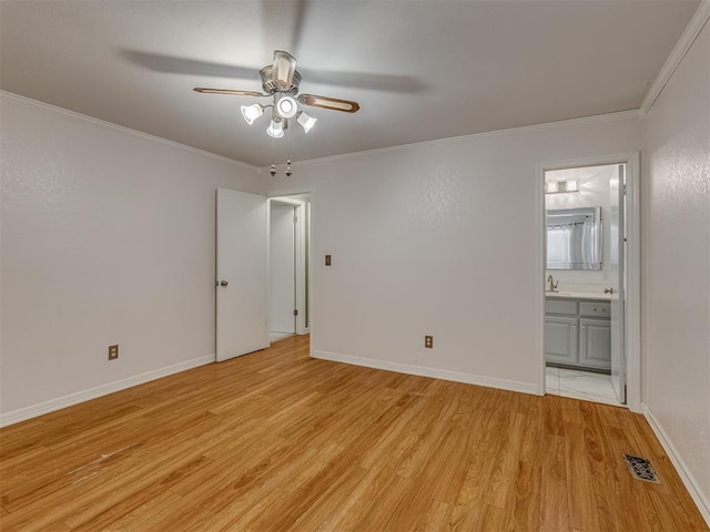 8709 NW 86th St, Oklahoma City, OK 73132 - unfurnished bedroom with light wood-style flooring, crown molding, ensuite bath, baseboards, and ceiling fan