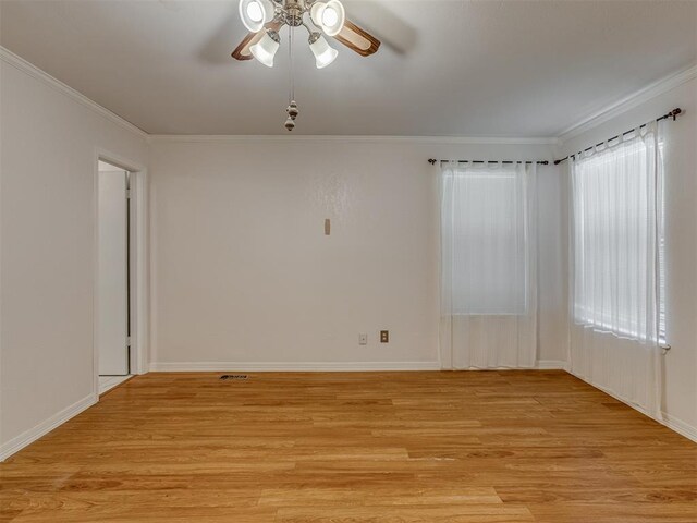 8709 NW 86th St, Oklahoma City, OK 73132 - spare room with ornamental molding, light wood finished floors, a ceiling fan, and baseboards