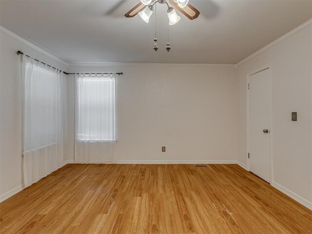 8709 NW 86th St, Oklahoma City, OK 73132 - unfurnished room featuring light wood finished floors, ceiling fan, crown molding, and baseboards