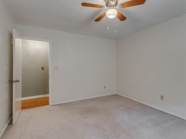 8709 NW 86th St, Oklahoma City, OK 73132 - empty room featuring carpet floors, ceiling fan, and baseboards