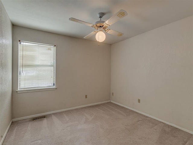 8709 NW 86th St, Oklahoma City, OK 73132 - unfurnished room featuring light carpet, a ceiling fan, and baseboards