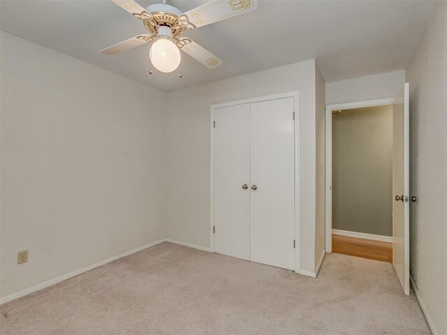 8709 NW 86th St, Oklahoma City, OK 73132 - unfurnished bedroom with light colored carpet, a closet, a ceiling fan, and baseboards