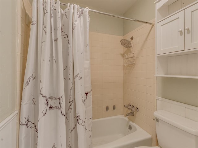 8709 NW 86th St, Oklahoma City, OK 73132 - bathroom featuring shower / tub combo, toilet, and wainscoting