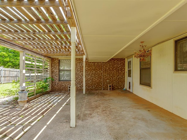 8709 NW 86th St, Oklahoma City, OK 73132 - view of patio / terrace featuring fence and a carport