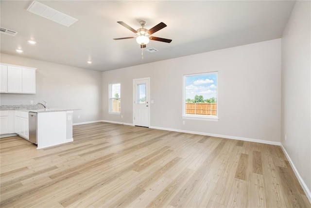 5450 Mac Rd, Tuttle, OK 73089 - unfurnished living room featuring a ceiling fan, light wood finished floors, baseboards, and recessed lighting