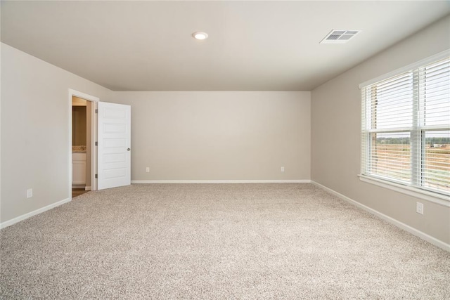 5450 Mac Rd, Tuttle, OK 73089 - spare room featuring carpet flooring and baseboards