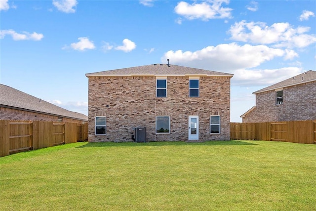 5450 Mac Rd, Tuttle, OK 73089 - back of property featuring central AC and brick siding
