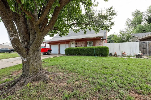 6508 S Harvey Ave, Oklahoma City, OK 73139 - view of front of property featuring concrete driveway and a garage