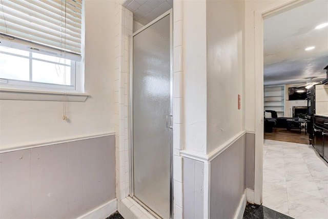 6508 S Harvey Ave, Oklahoma City, OK 73139 - full bath with a shower stall, a wainscoted wall, and a decorative wall