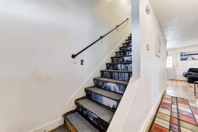 6508 S Harvey Ave, Oklahoma City, OK 73139 - stairway featuring baseboards and wood finished floors