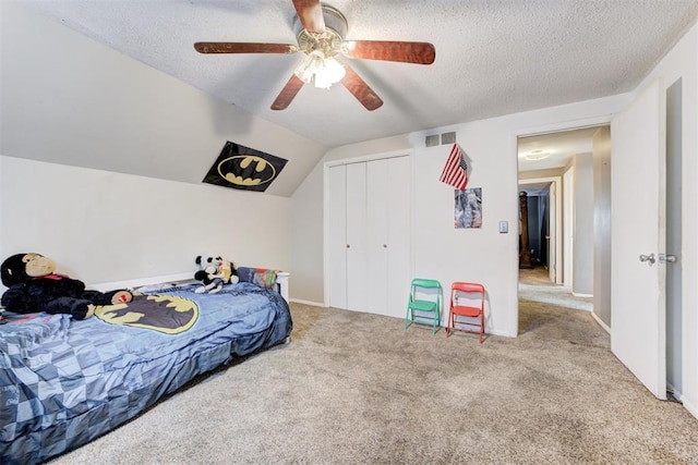 6508 S Harvey Ave, Oklahoma City, OK 73139 - carpeted bedroom featuring a closet, a textured ceiling, and ceiling fan