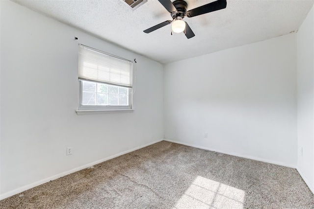6508 S Harvey Ave, Oklahoma City, OK 73139 - empty room with carpet flooring, a ceiling fan, baseboards, and a textured ceiling