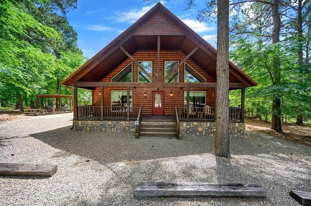 479 Poplar Cir, Broken Bow, OK 74728 - rustic home with log veneer siding and a porch