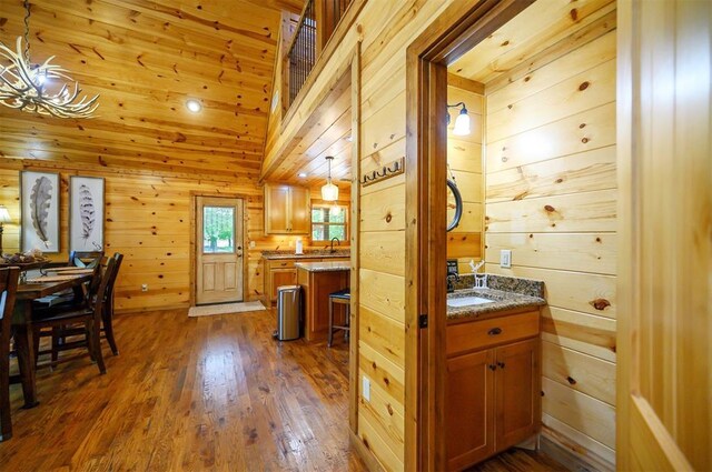 479 Poplar Cir, Broken Bow, OK 74728 - bathroom with wood finished floors, wooden walls, and vanity
