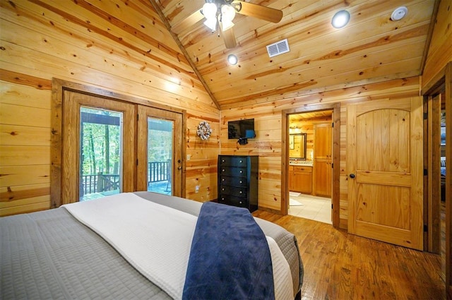 479 Poplar Cir, Broken Bow, OK 74728 - bedroom with lofted ceiling, wooden walls, access to outside, wooden ceiling, and light wood-type flooring