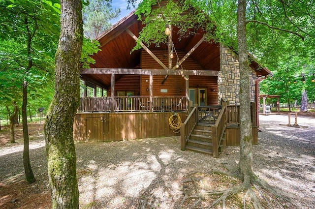 479 Poplar Cir, Broken Bow, OK 74728 - view of front of home with faux log siding and a porch