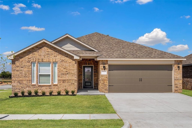 ranch-style home featuring brick siding, a front lawn, roof with shingles, an attached garage, and driveway