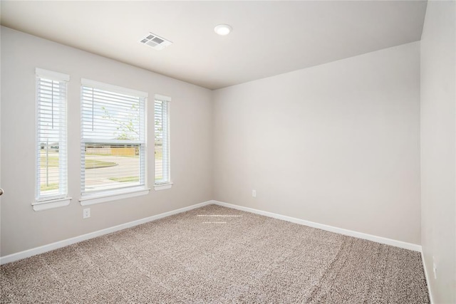 spare room with carpet floors and baseboards