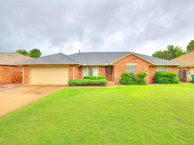 10021 Henderson Dr, Oklahoma City, OK 73139 - ranch-style house featuring a garage, brick siding, a front yard, and concrete driveway