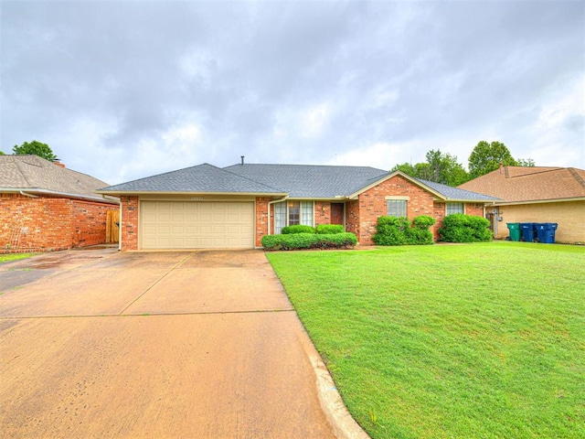 10021 Henderson Dr, Oklahoma City, OK 73139 - ranch-style home with an attached garage, brick siding, driveway, a front yard, and a shingled roof