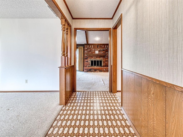 10021 Henderson Dr, Oklahoma City, OK 73139 - corridor featuring carpet floors, a textured ceiling, baseboards, and ornamental molding