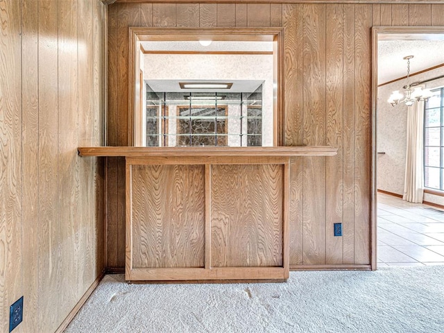 10021 Henderson Dr, Oklahoma City, OK 73139 - detailed view of wood walls, carpet floors, and a chandelier